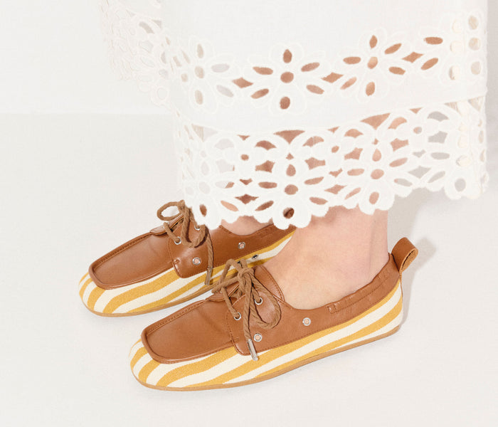 Freda Salvador RIA soft boat loafer in mustard yellow and white canvas, featuring a sleek slip-on design and casual style.