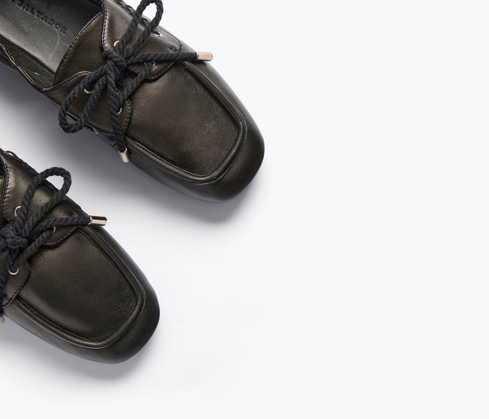 Freda Salvador RIA soft black nappa leather boat shoe loafer with sleek design and detailed stitching.