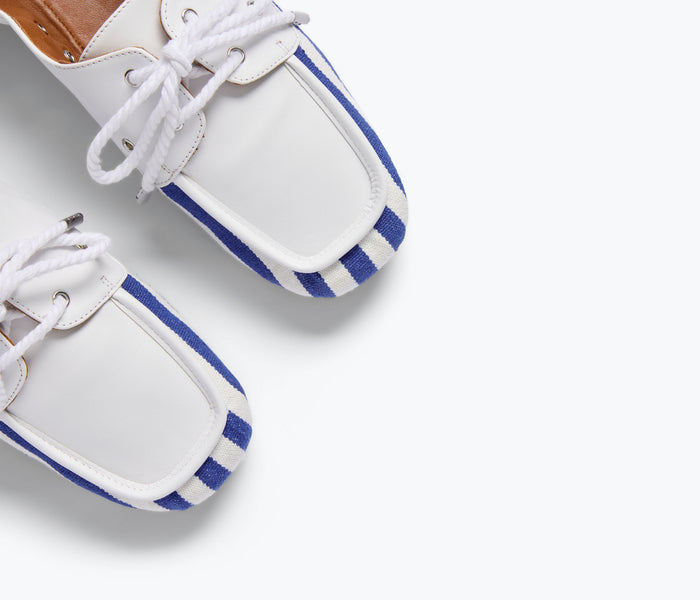 Freda Salvador RIA soft navy and white canvas boat shoe loafer with detailed stitching and classic slip-on design.