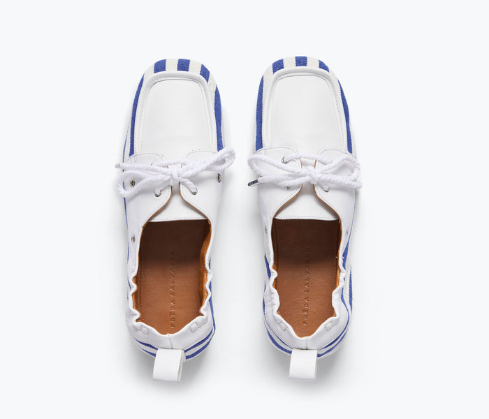 Navy and white canvas Freda Salvador RIA soft boat shoe loafer with slip-on design and stitched detailing.