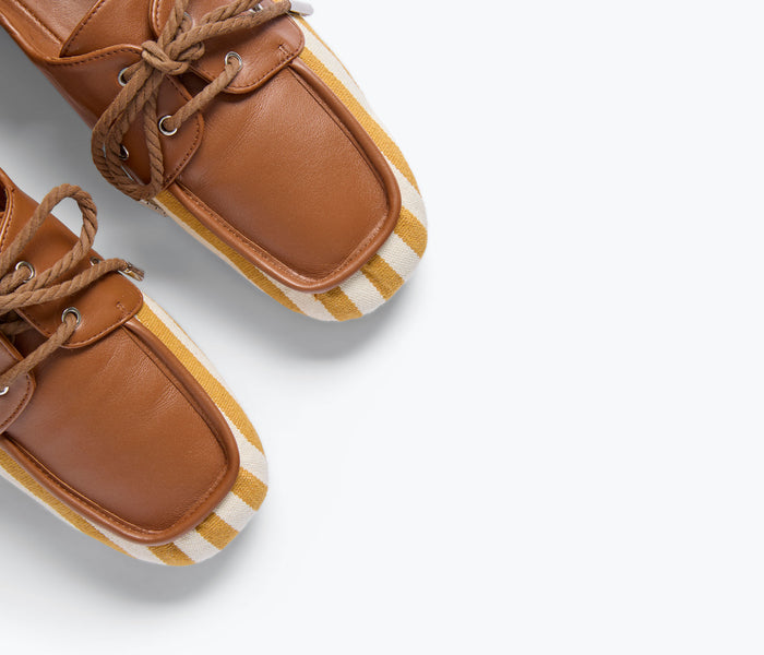 Freda Salvador RIA soft boat shoe loafer in mustard and white canvas with detailed stitching and casual slip-on design.
