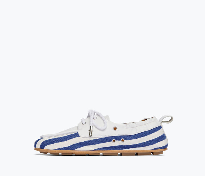 Freda Salvador RIA soft navy and white canvas boat shoe loafer with interior view showing stitching and lining.