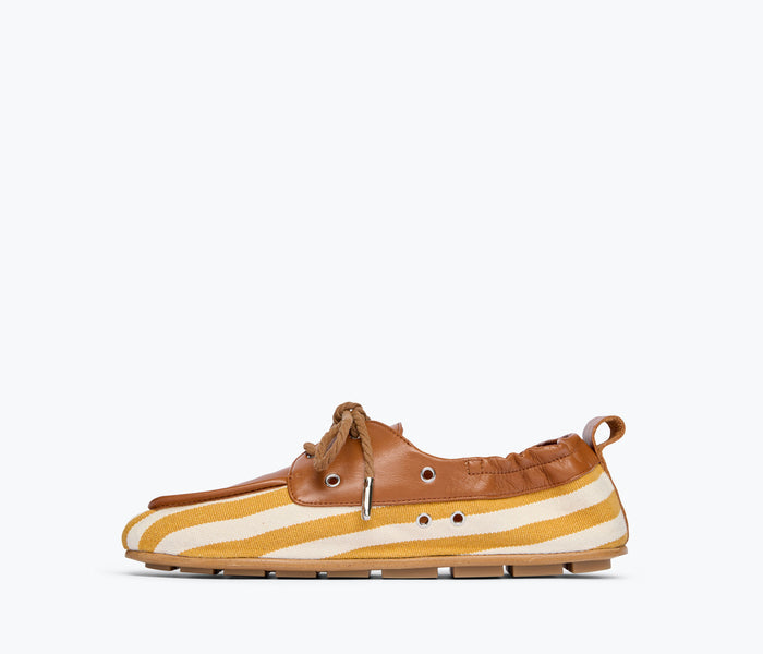 Freda Salvador RIA soft boat shoe loafer in mustard and white canvas, showing the interior and side view.