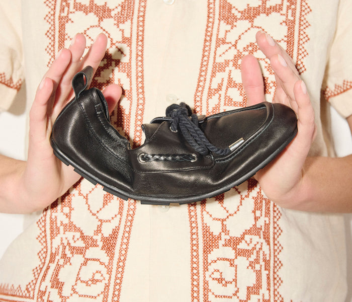 Black RIA soft boat shoe loafer by Freda Salvador, featuring smooth nappa leather and classic slip-on design.