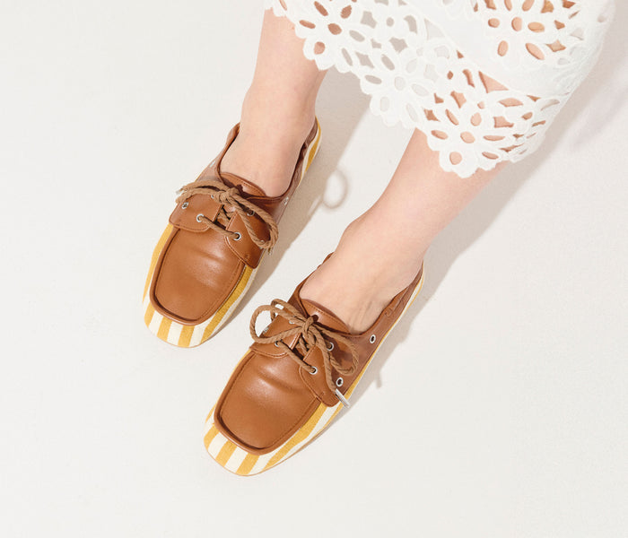 Freda Salvador RIA soft boat loafer in mustard and white canvas, featuring a classic slip-on design and casual boat shoe style.