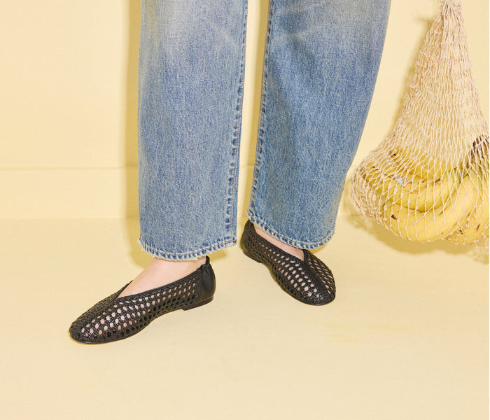 Black Riley open weave ballet flat by Freda Salvador with a sleek, minimalist design and breathable open weave pattern.
