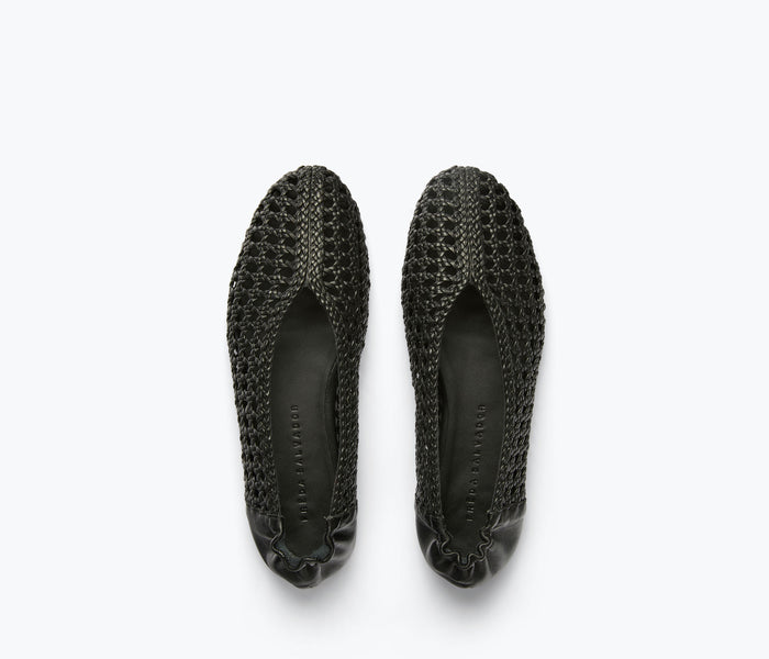 Black Riley open weave ballet flat by Freda Salvador, showing the textured top and sleek silhouette of the flat shoe.