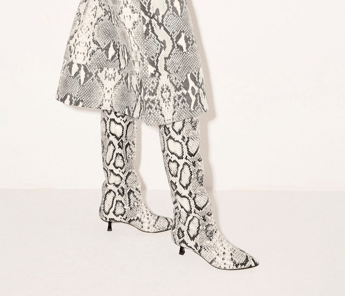 Freda Salvador Robyn tall snake-print boot with pointed toe and slim heel, stylish footwear for fall and winter outfits.