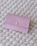 Mauve leather dog waste bag holder, stylish and compact for daily walks