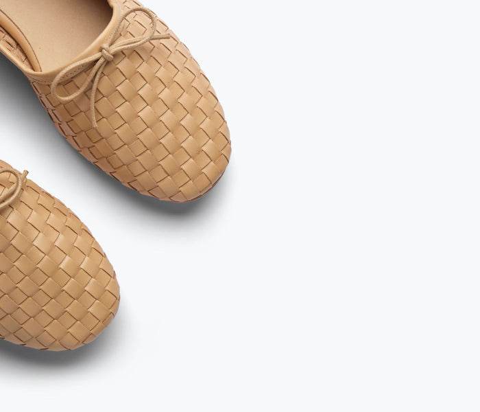 Freda Salvador Roma round toe ballet flat in latte woven calf leather, showcasing a sleek, closed-toe design with detailed craftsmanship.