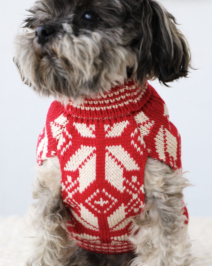 Holiday dog sweater with red and white knit pattern for festive style.