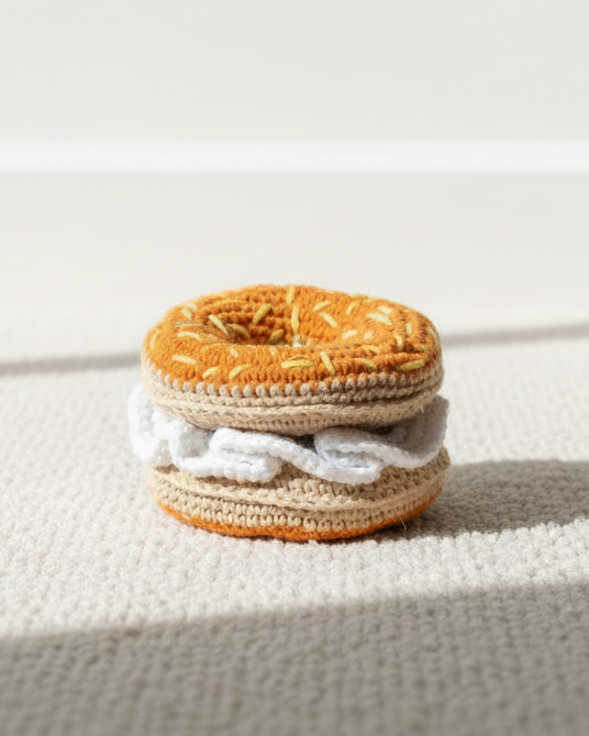 bagel dog toy close up crochet plush enrichment toy for interactive sniff play