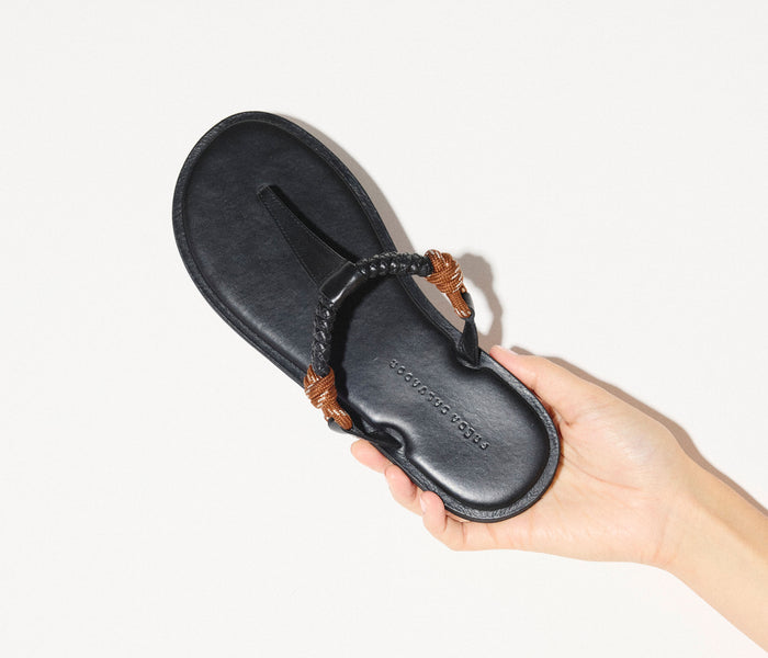Freda Salvador Selah Rope Thong Sandal in chocolate with woven rope straps and flat sole on a neutral background.