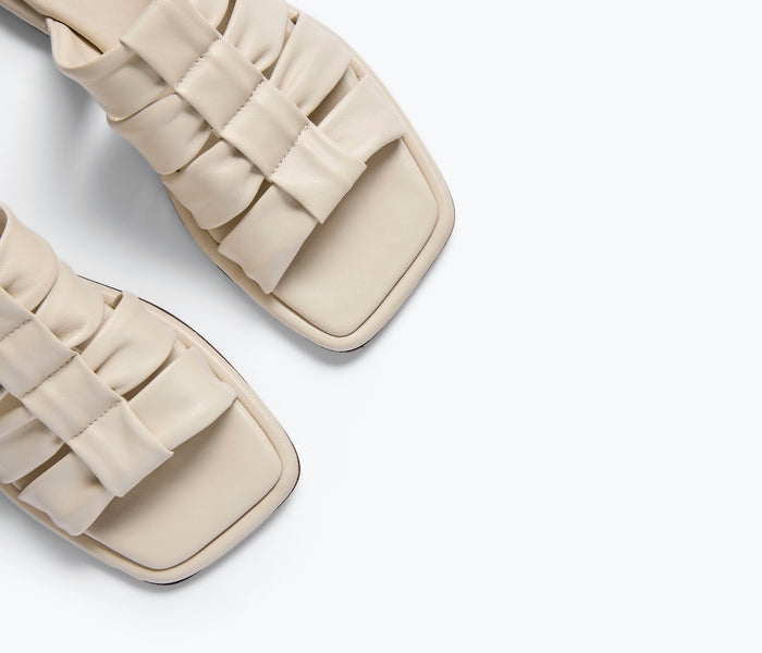 Freda Salvador Selena Cloud Mule Sandal in vanilla napa leather with detailed stitching and sleek design.