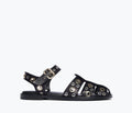 Black SERA Fisherman sandal by FREDA SALVADOR with front grommet details, showcasing a stylish and comfortable footwear design.