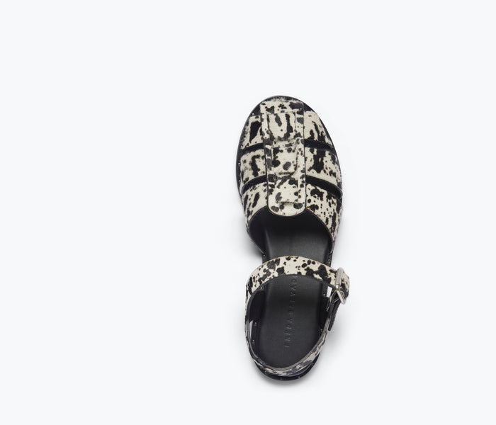 Black and white SERA Fisherman sandal by FREDA SALVADOR with woven top design, featuring a closed toe and sturdy sandal style.