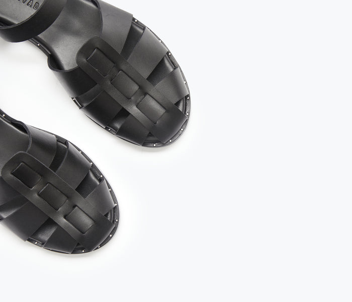 Black SERA Fisherman Sandal by FREDA SALVADOR featuring a woven strap design and open toe style.