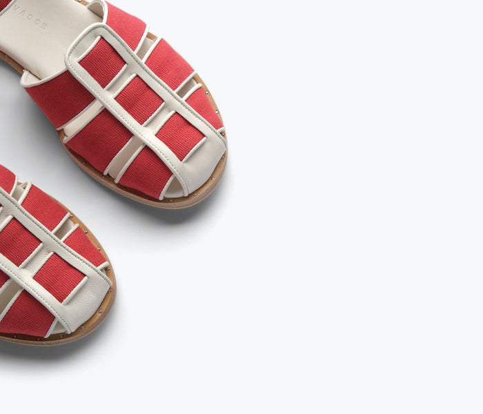 Close-up of red SERA FISHERMAN SANDAL by FREDA SALVADOR, showing detailed straps and craftsmanship.