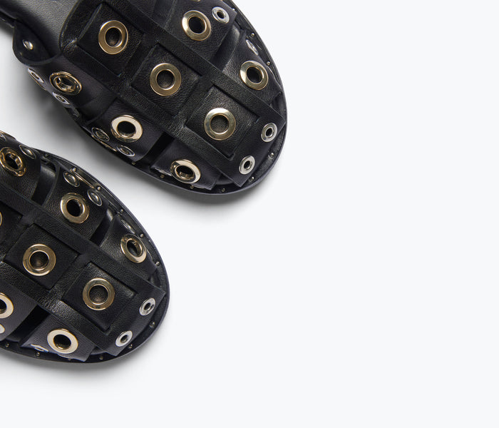 Black SERA FISHERMAN sandal by FREDA SALVADOR with grommet details and adjustable straps.