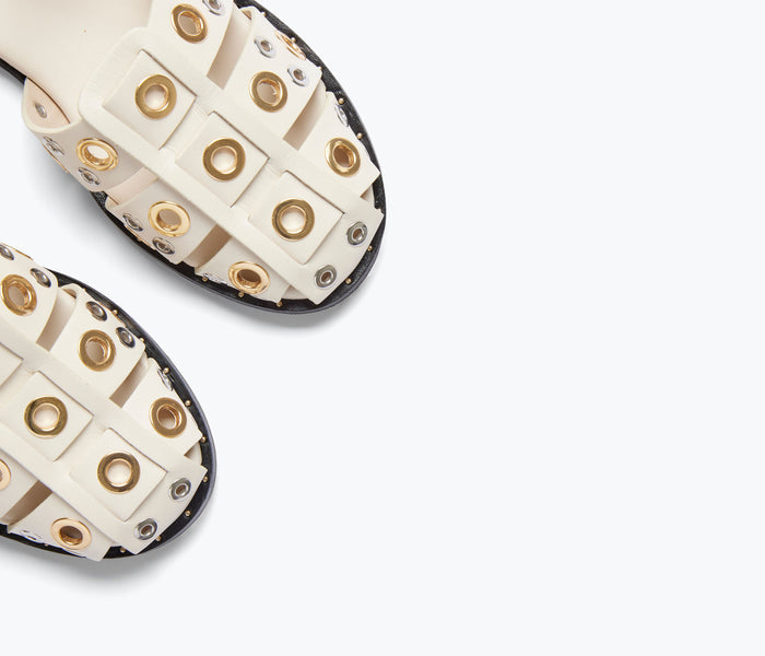 Freda Salvador SERA Fisherman Sandal in bone color with grommet details, showcasing the stylish open-toe sandal design.