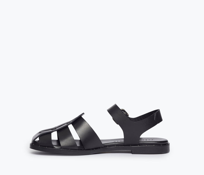 Black SERA Fisherman Sandal by FREDA SALVADOR with leather straps and inside view showing detailed craftsmanship.