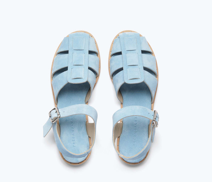 Blue suede Sera fisherman sandal by Freda Salvador featuring a strappy design and open toe.