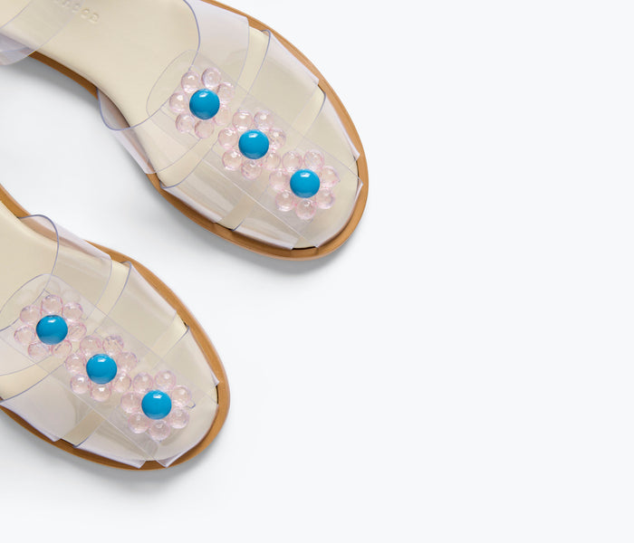 Freda Salvador SERA Fisherman Sandal with clear PVC straps and floral embellishments, stylish open-toe design for warm weather.