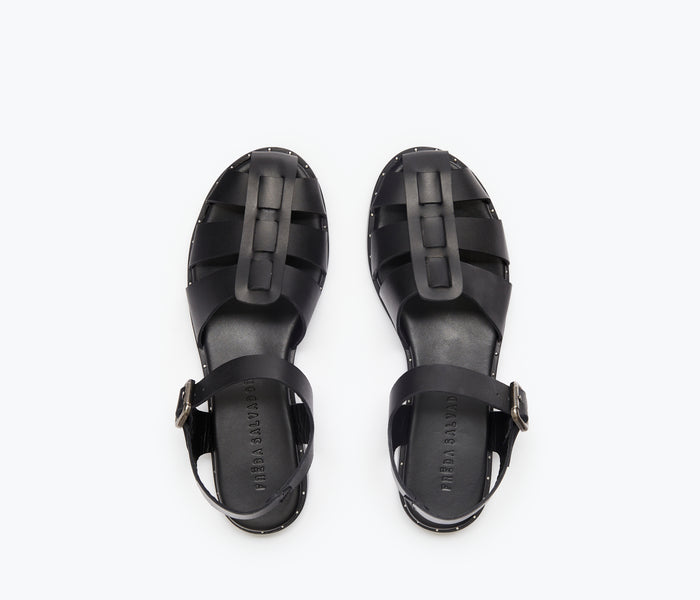 Black SERA FISHERMAN sandal by FREDA SALVADOR with a woven strap design and closed toe, perfect for casual summer wear.