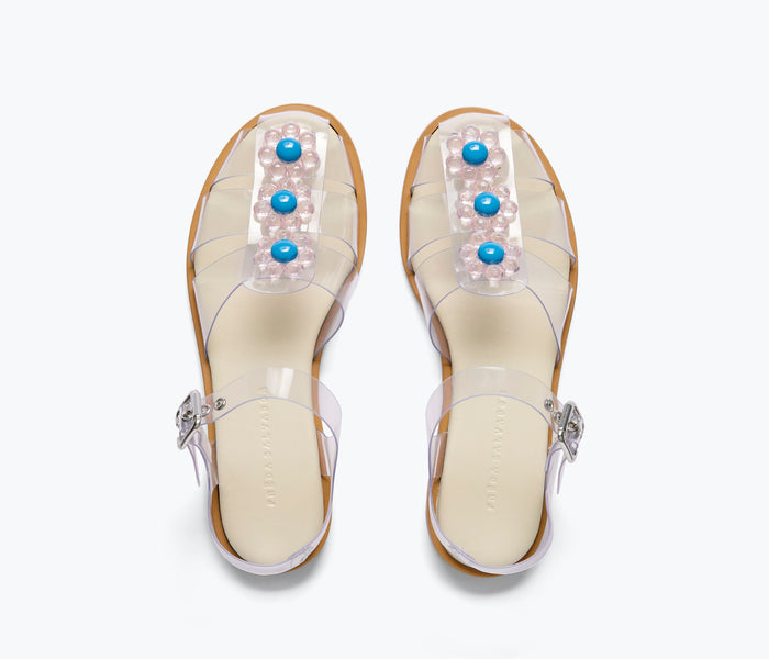 Freda Salvador Sera Fisherman Sandal with clear PVC straps and floral embellishments, showcasing stylish open-toe design.