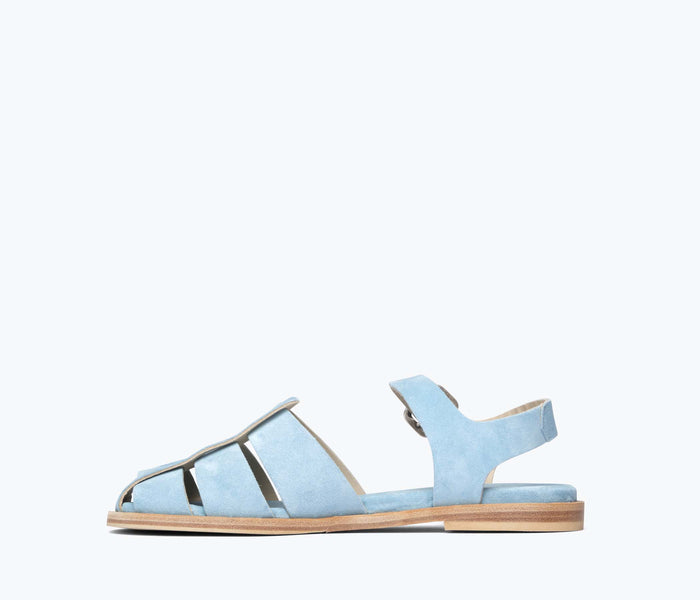 Blue suede SERA FISHERMAN sandal by FREDA SALVADOR with inside view showing textured footbed and stylish design.