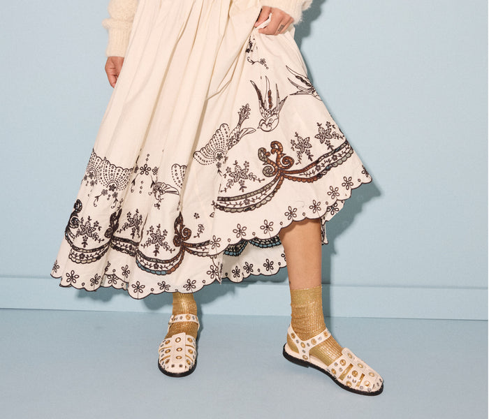 Freda Salvador SERA fisherman sandal in bone color with grommet details, featuring a strappy leather design and open toe style.
