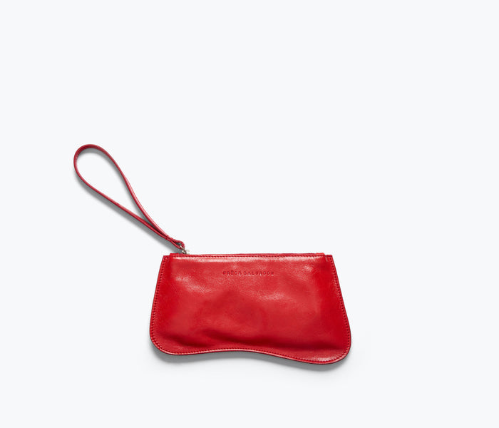 Red crinkle leather Serena slip pouch by FREDA SALVADOR, featuring a sleek front design and compact SLG style for essentials.