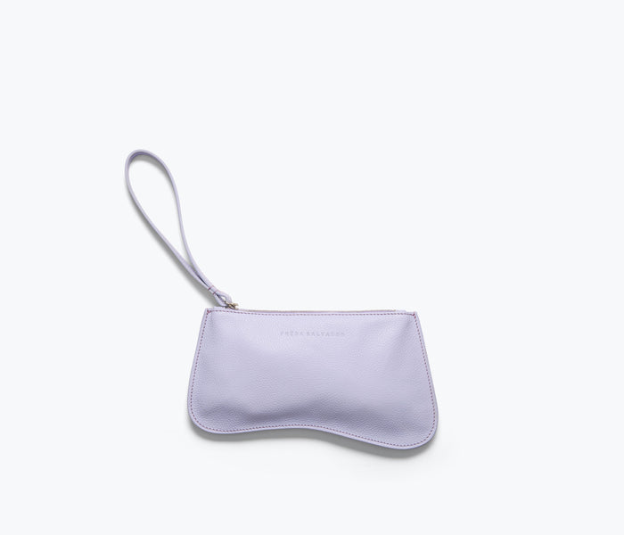 Freda Salvador Serena slip pouch in lavender pebble leather, compact bag with gold hardware and textured finish.
