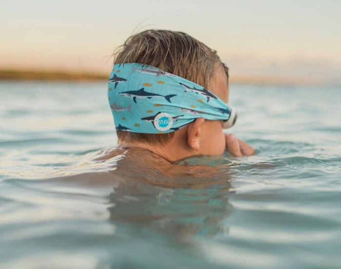 Boy swimming with Splash Place Shark Tangle-Free Swim Goggles. Available from www.tenlittle.com