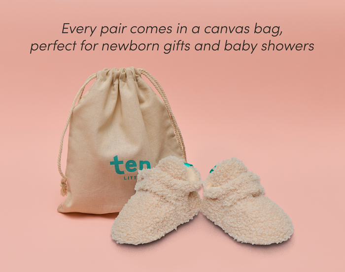 Front and side view of Ten Little Sherpa Baby Booties with a canvas bag, perfect for newborn gifts and baby showers. Available at www.tenlittle.com