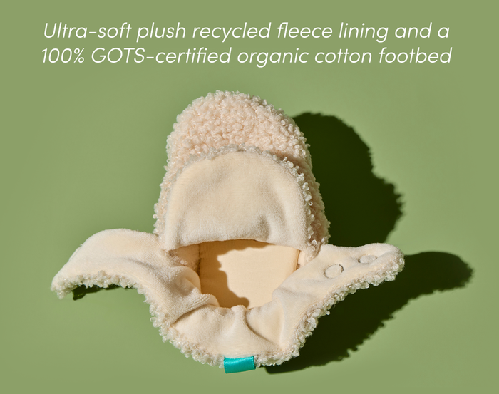Top view of unbuttoned Ten Little Sherpa Baby Booties made with ultra-soft plush recycled fleece lining and a 100% GOTS-certified organic cotton footbed. Available at www.tenlittle.com