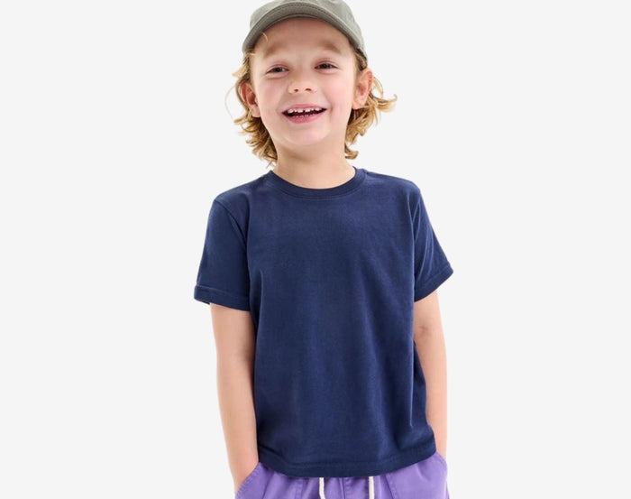 Boy wearing Primary Short Sleeve Classic Tee in Navy - 3 Pack - Vintage Blue Mix. Available at www.tenlittle.com