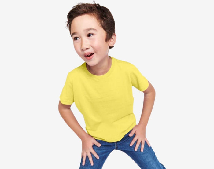 Boy wearing Primary Short Sleeve Classic Tee in Banana - 3 Pack - Banana Mix. Available at www.tenlittle.com