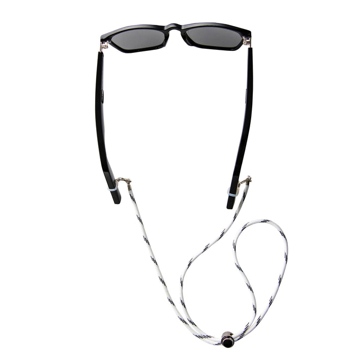 Black rectangular sunglasses with dark lenses are shown from above, attached to a Lucyd Sport Strap in a black and white braid with looped ends, against a white background.
