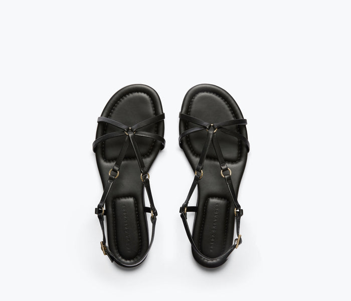 Black Stella sandal by Freda Salvador featuring a calf leather strap and sleek design, perfect for stylish summer footwear.