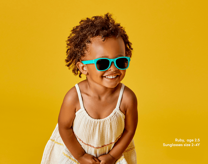 Girl age 2.5 wearing Ten Little Sunglasses size 2-4Y - Teal. Available at www.tenlittle.com