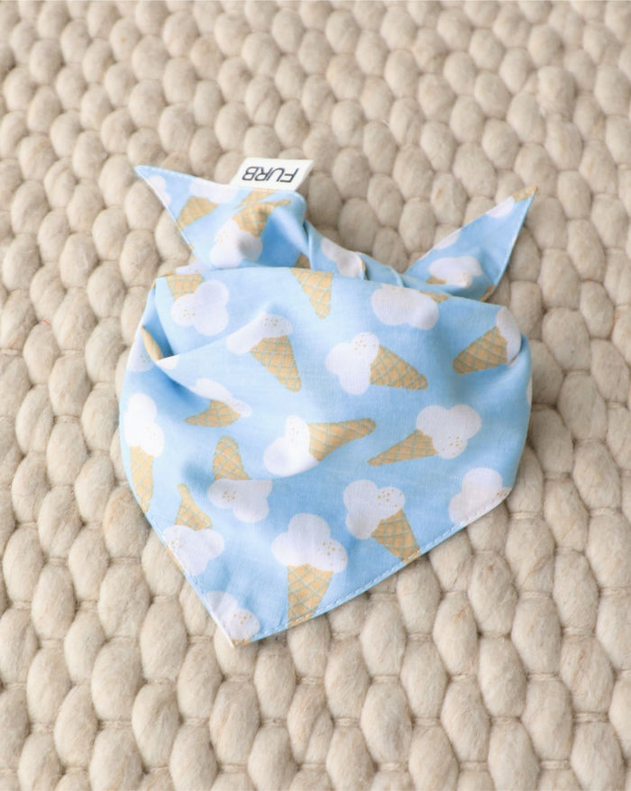 Blue dog bandana, ideal for Boston Terriers, Cavaliers, and Shih Tzus. Adds color and charm to walks or social outings.