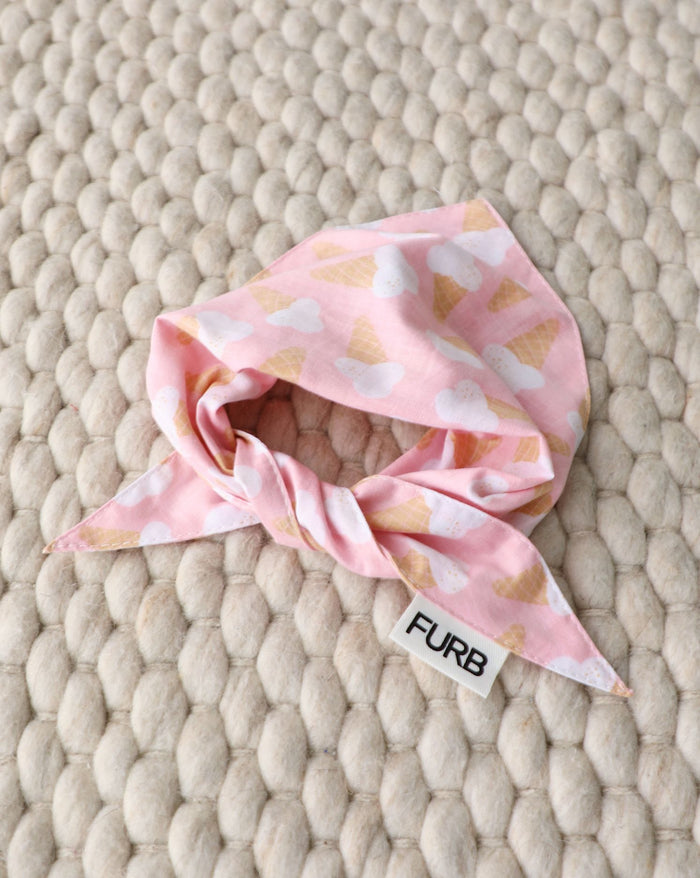 Stylish Sweet Tooth pink bandana for playful Pomeranians, Mini Aussies, and Cocker Spaniels during casual outings.