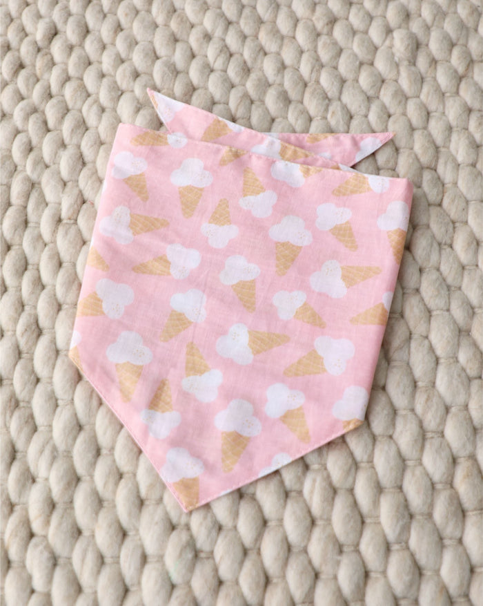 Fun pink dog bandana, perfect for French Bulldogs, Mini Schnauzers, and Cavaliers enjoying sunny walks or park adventures.