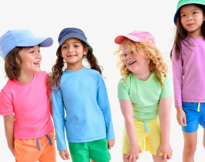Kids wearing Primary Swim Trunks - 2 Pack - Assorted Colors. Available at www.tenlittle.com