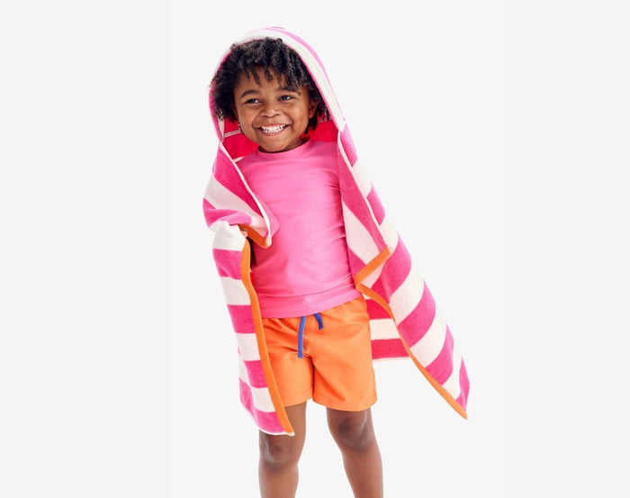 Child wearing Primary Swim Trunks in Cantaloupe - 2 Pack - Blueberry / Cantaloupe. Available at www.tenlittle.com