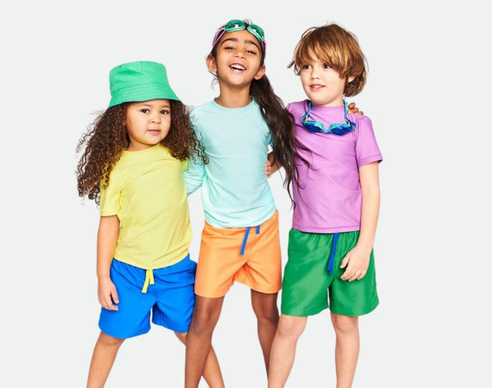 Kids wearing Primary Swim Trunks - 2 Pack - Assorted Colors. Available at www.tenlittle.com