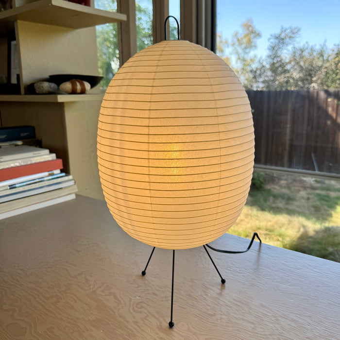 Tawara Lamp A121 is a A modern "Chochin" lantern lamp designed by Shigeru Uchida and handmade by Asano Shoten in Gifu, Japan, showing its gentle glow.