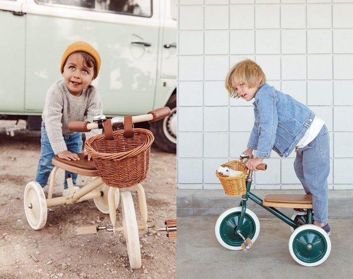 Child using Banwood Trike in cream and another child using Banwood Trike in green. Available from tenlittle.com