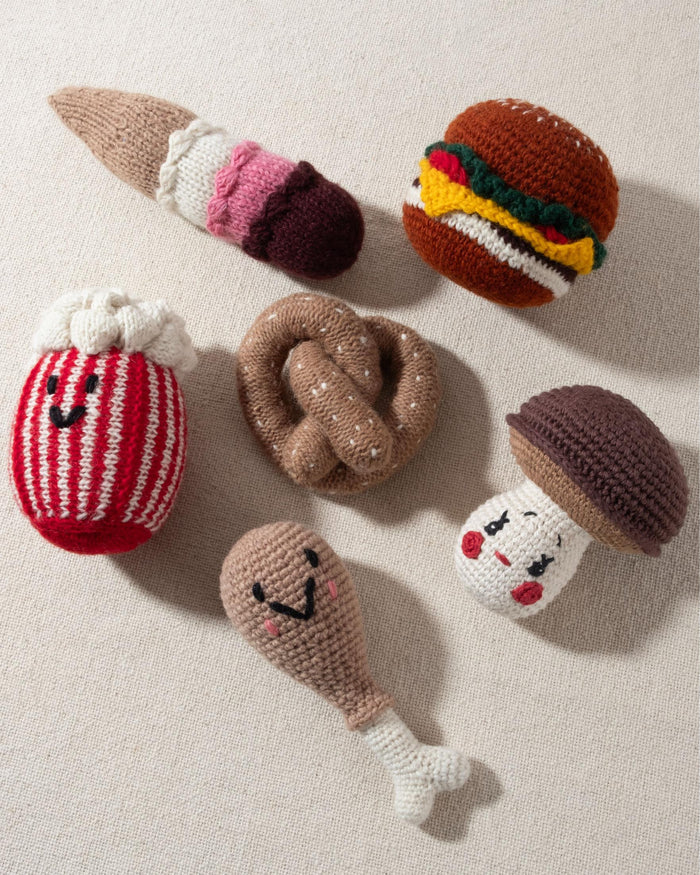 tan and white hand knit crochet pretzel dog toy